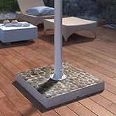 White river stone base mount outdoor TV with a solid steel pole on a wooden floor courtyard in Qatar.