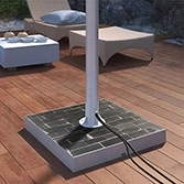 Stone base mount slate for outdoor TV with a rustproof post in a deck and furniture at the back in Qatar.